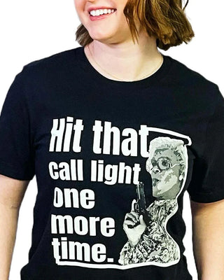 Nurse T-shirt on model that says hit that call light one more time.