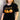female model wearing black nightshift t-shirt in front of gray background.t  
