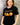 female model wearing black nightshift t-shirt in front of gray background.t  