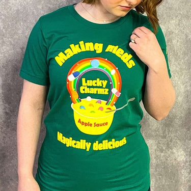 Female model wearing st patricks' day style nurse shirt that says lucky charmz making meds magically delicious.